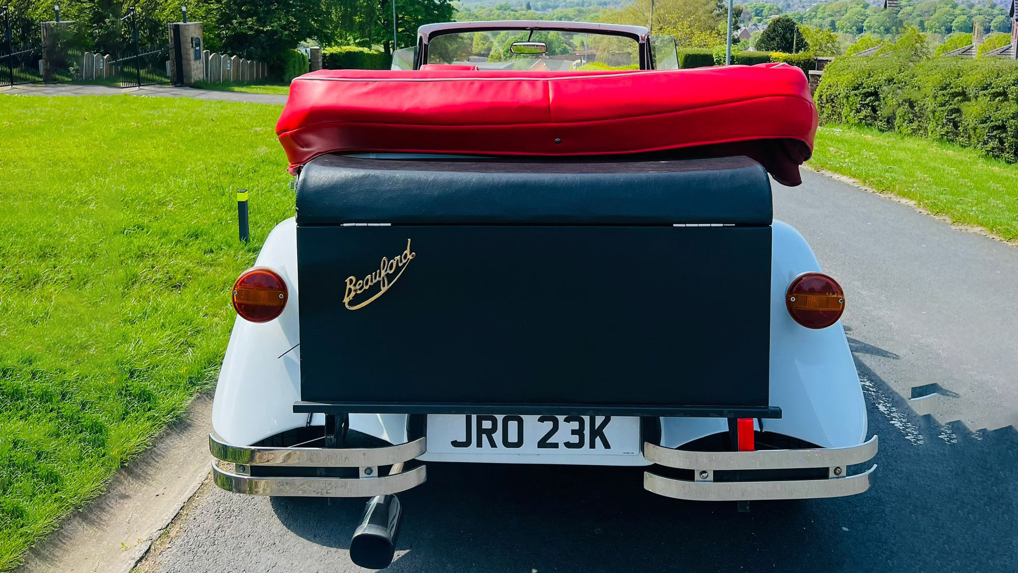 Full rear view of the White Beauford and its black picnic trunk