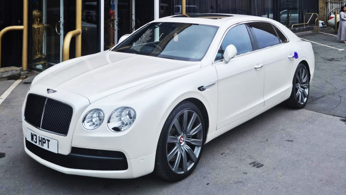 Left Side View of White Bentley Flying spur