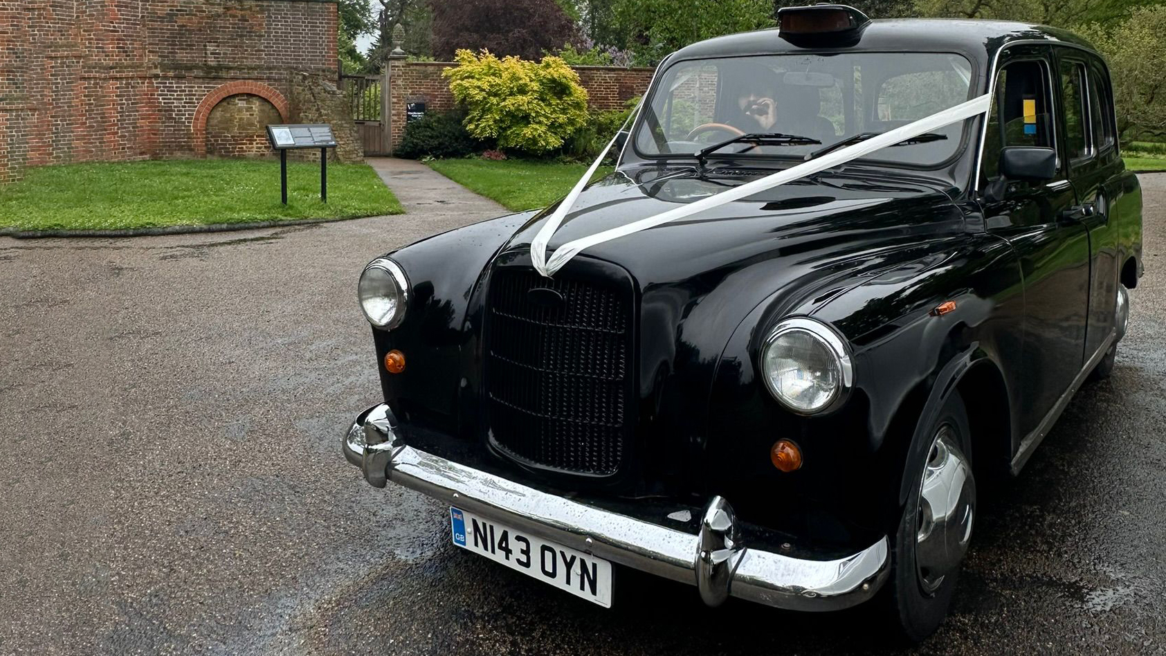 Front view of an iconic Black London Taxi Cab