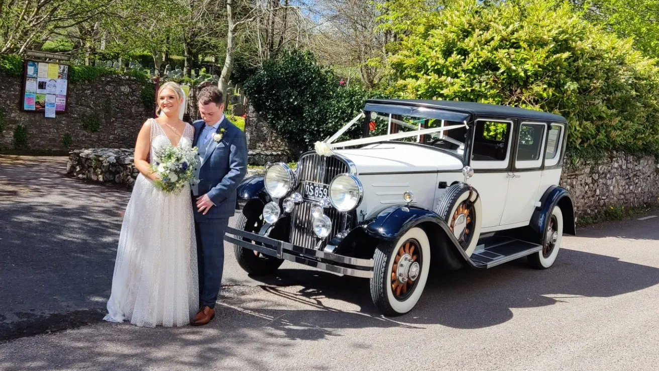 Bride and Groom with a Vintage  Franklin wedding car