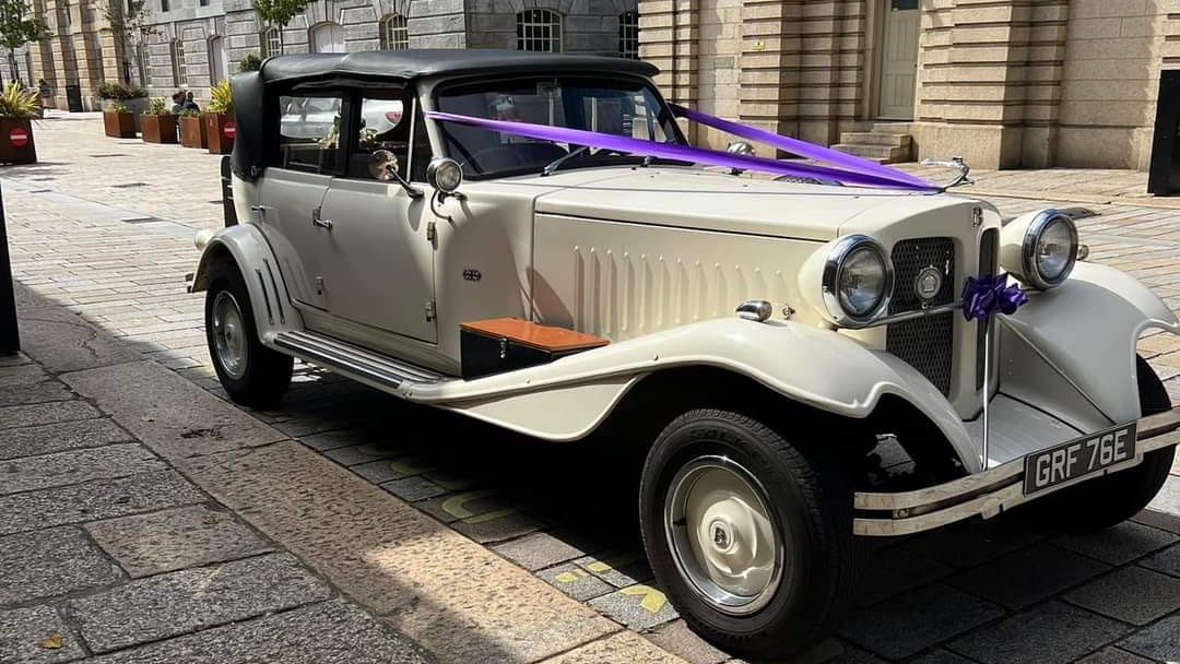 Beauford 4 Door Convertible with purple ribbons