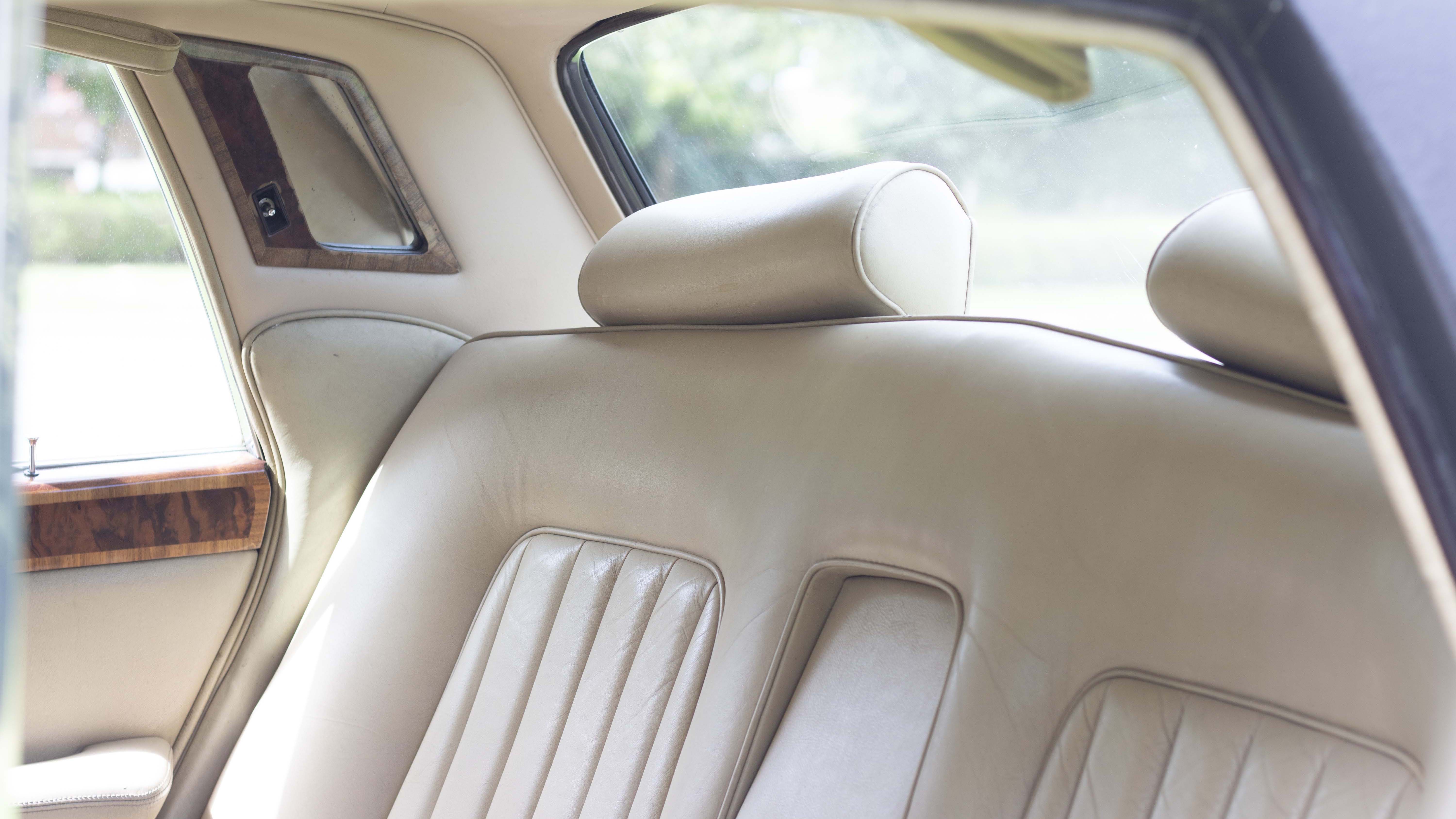 cream leather interior and vanity mirror in the rear of Classic Rolls-Royce silver shadow