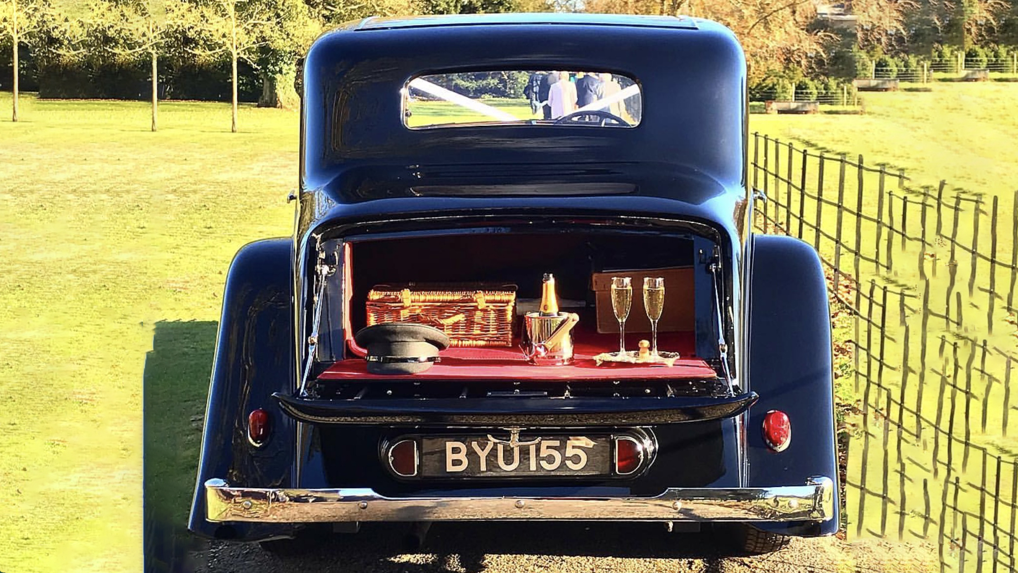 Rear boot open showing champagne bucket and glass