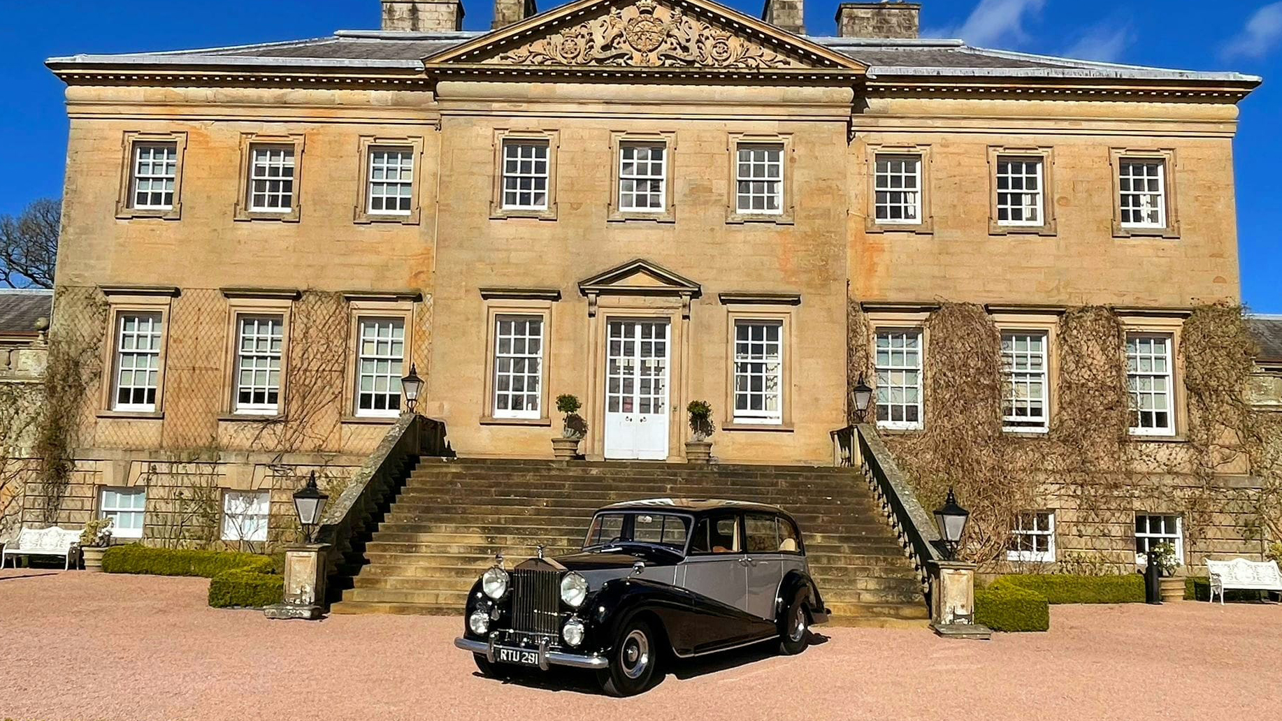 Classic Rols-Royce in Black and Silver in front of the main entrance at Dumfries House