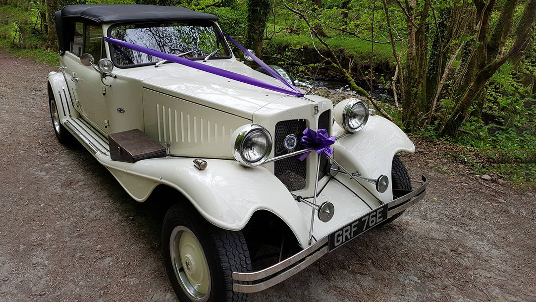 Beauford 4 Door Convertible decorated with cadbury purple ribbons