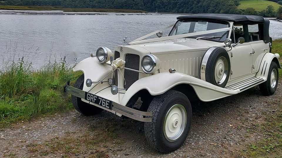 Beauford 4 Door Convertible with roof up decorated with ribbons