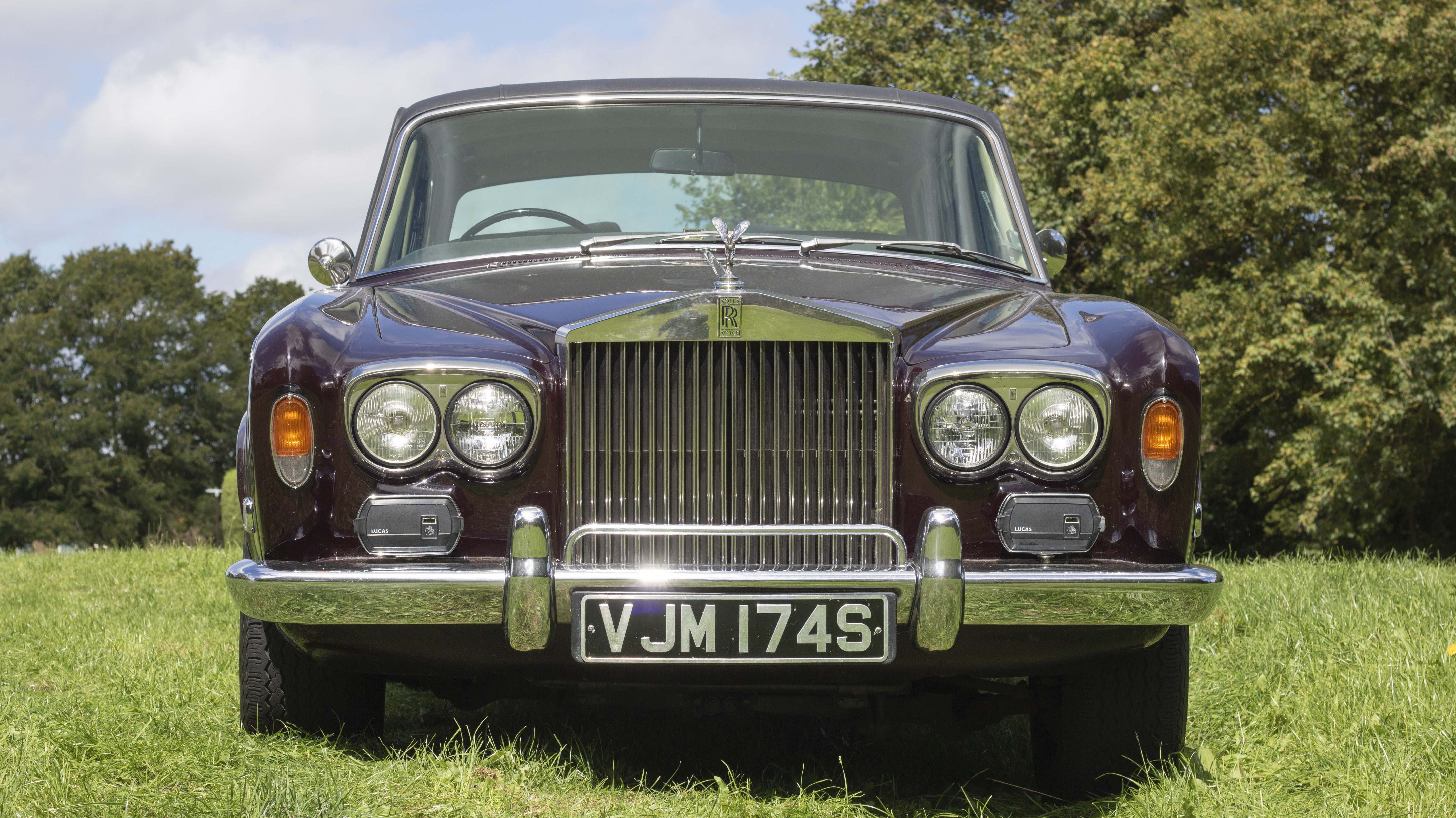 Full Front View of Classic Rolls-Royce in Garnet colour showing the iconic Rolls-Royce Grill and twin headlights