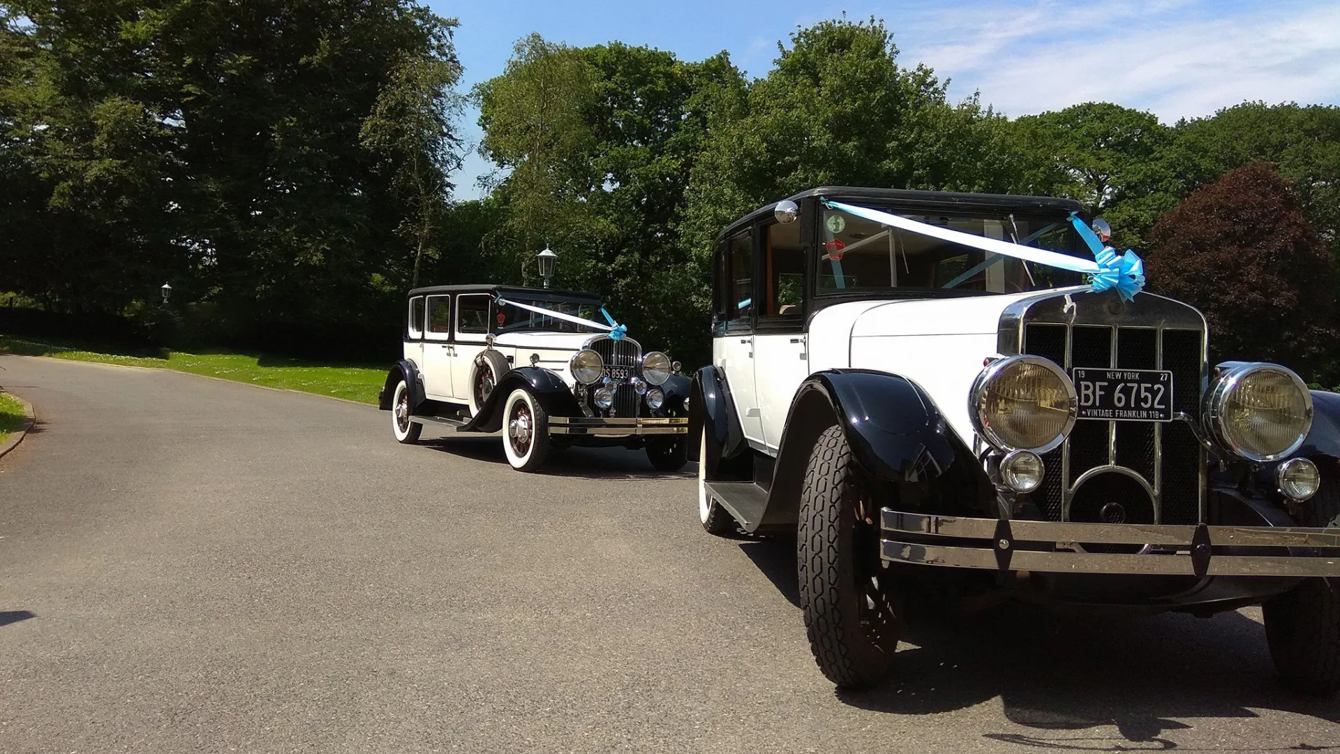 Two vintage Franklin in Black and White dressed with a matching light blue ribbons