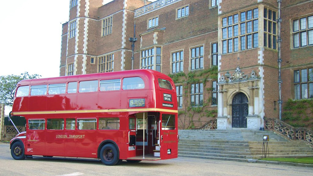 Side rear view of Red Routemaster bus open platform