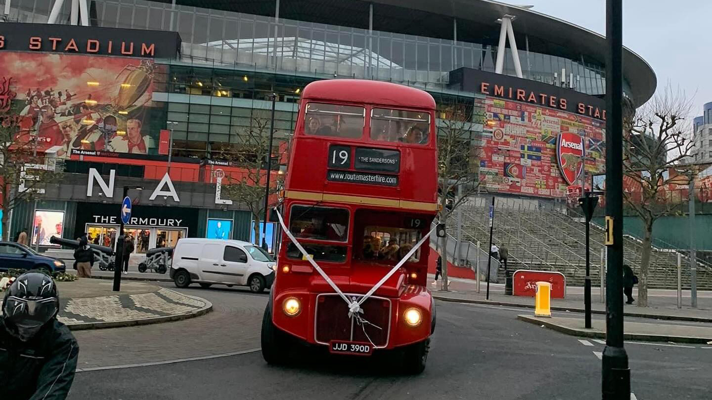 Front view of Red Routemaster bus with White ribbons