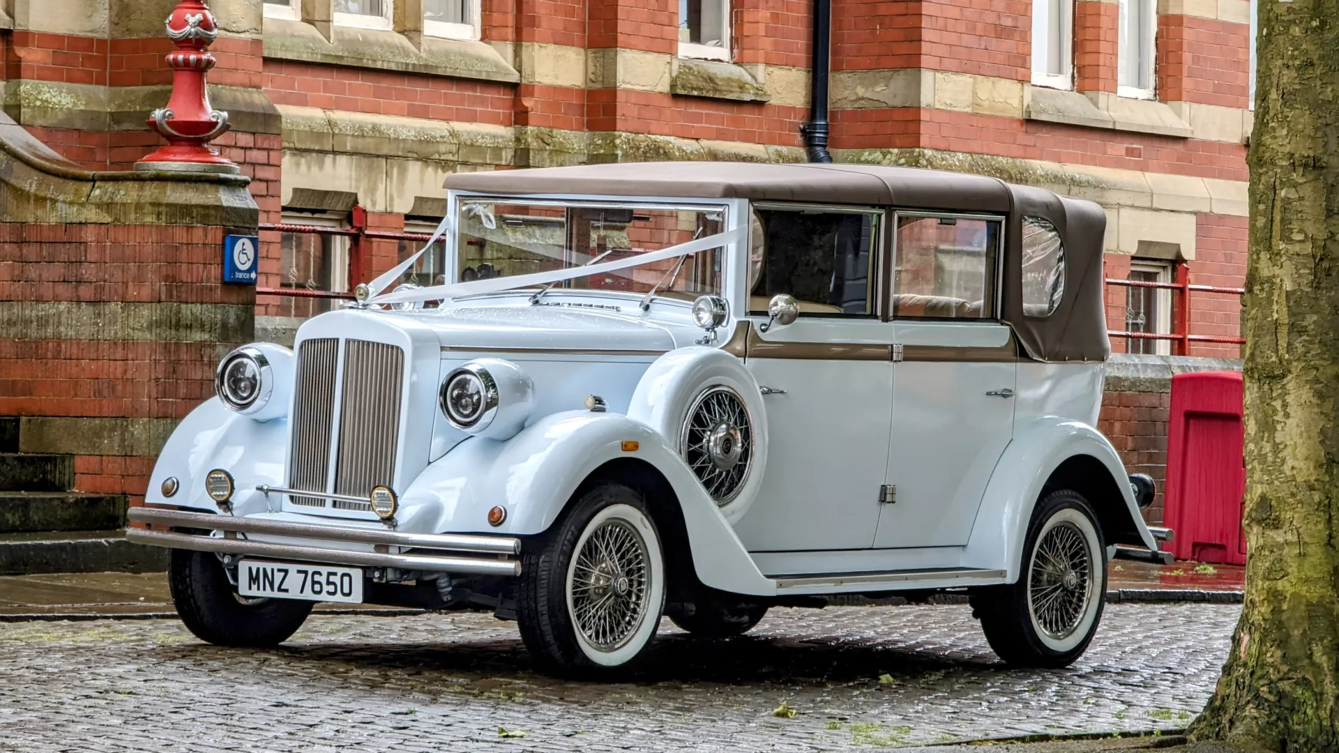 1930's vintage style car Manchester decorated with white ribbons