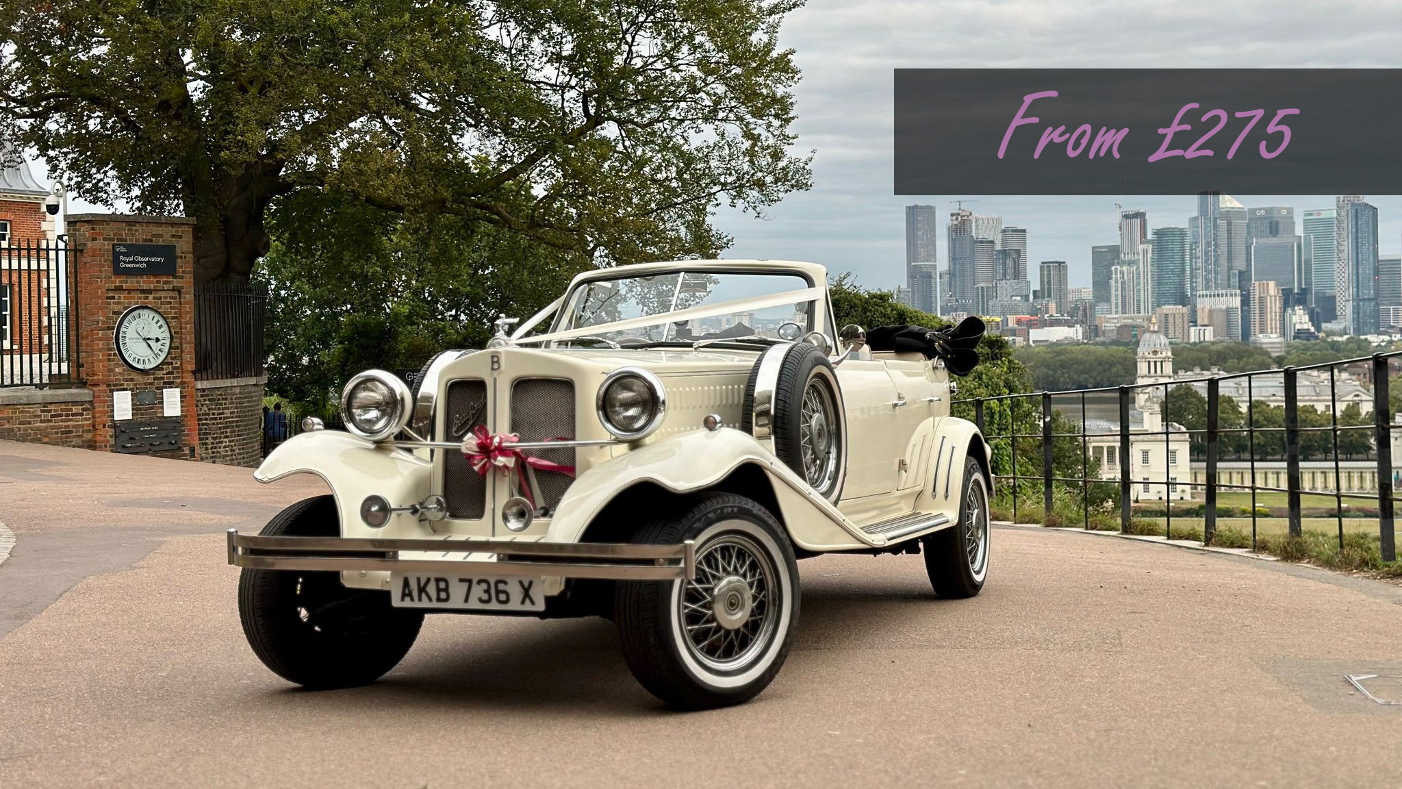 Vintage Ivory Beauford Convertible with roof down decorated with ivory ribbon and burgundy bow at the front displaying a from price of £275.