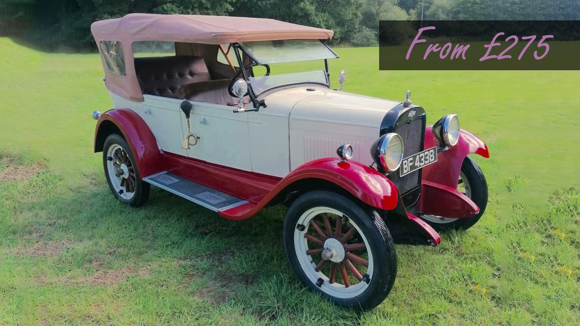 Vintage Chevrolet in burgundy and ivory with a cream soft-top roof and wooden spoke wheels displaying a cheap price of £275