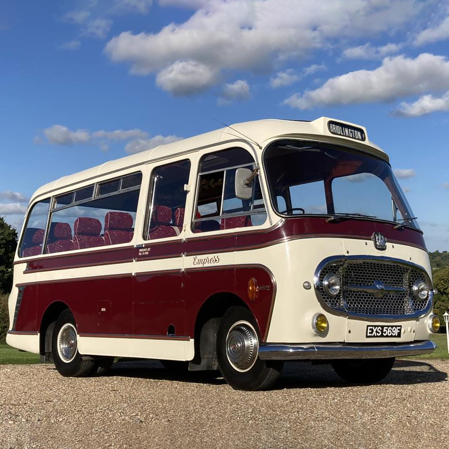Single Decker Bedford Bus in burgundy and ivory.