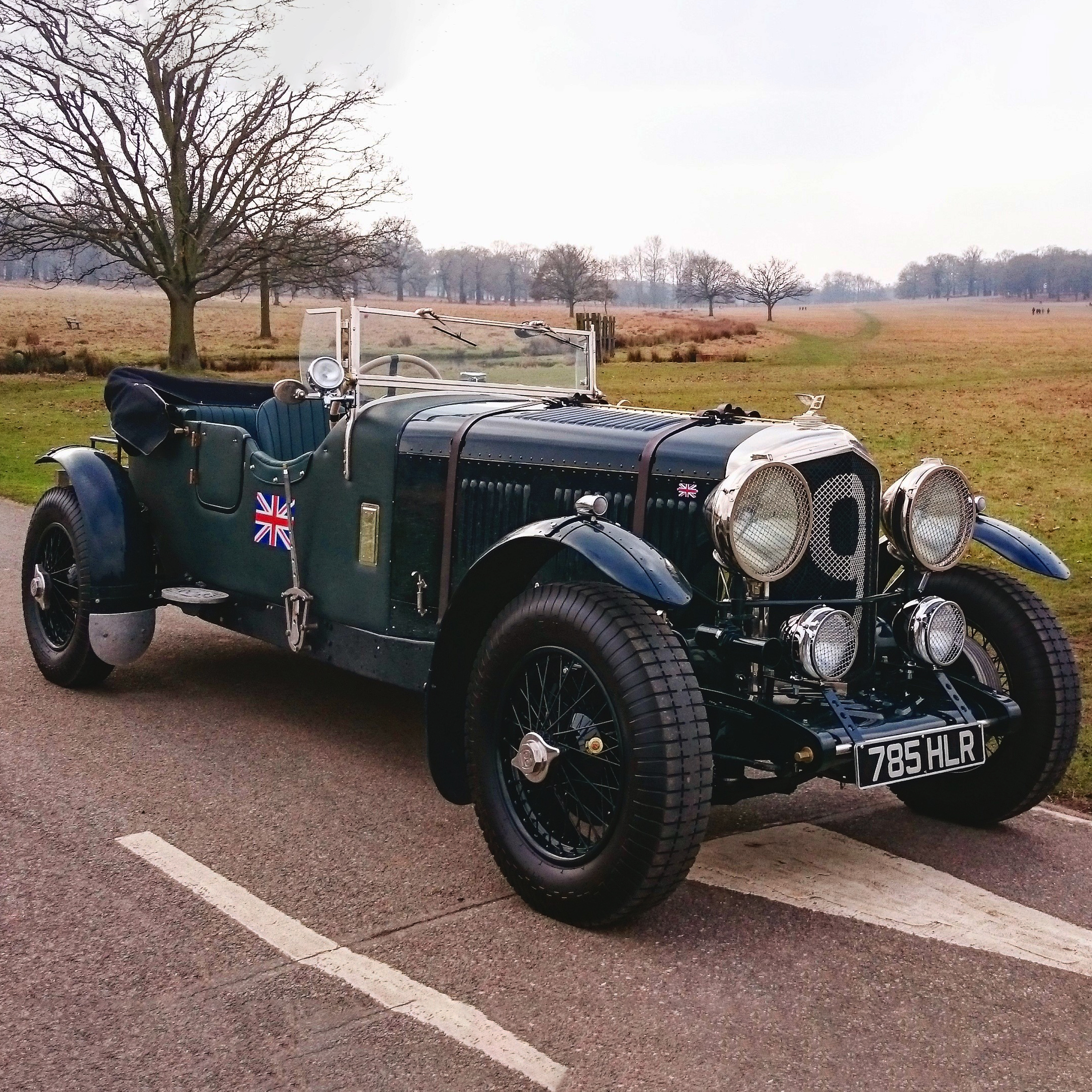 Army green vintage Bentley Forty convertible.