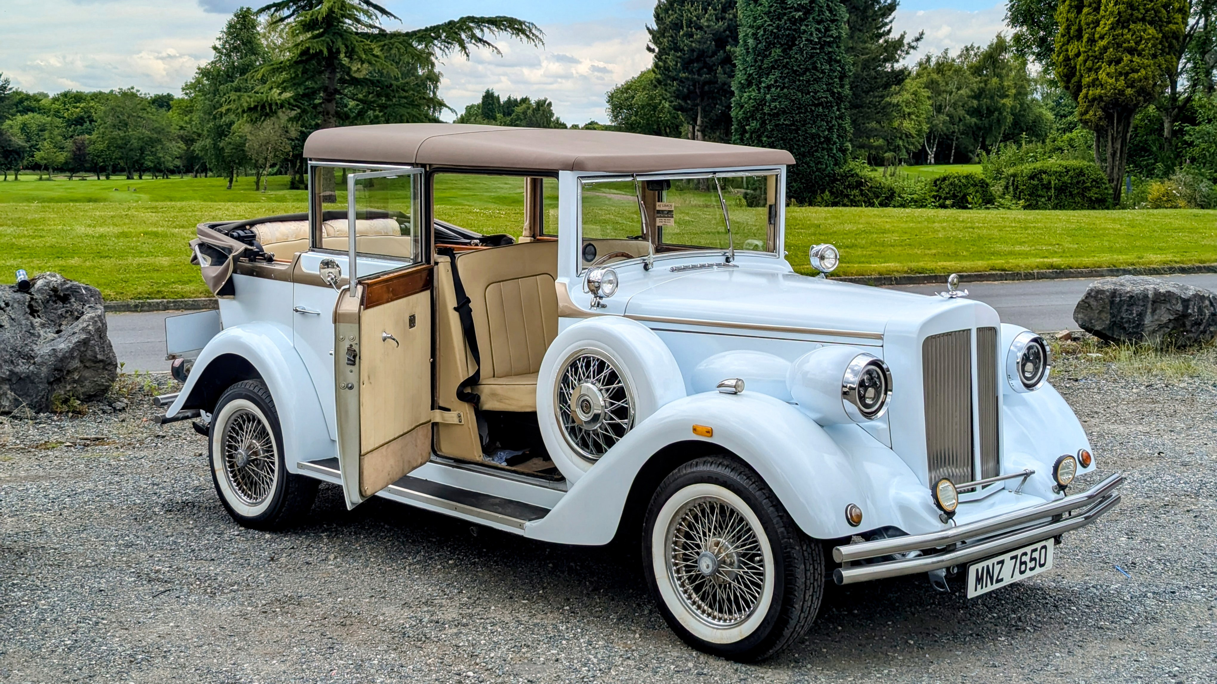 Convertible Regent Wedding Car in traditional white colour with rear Roof open