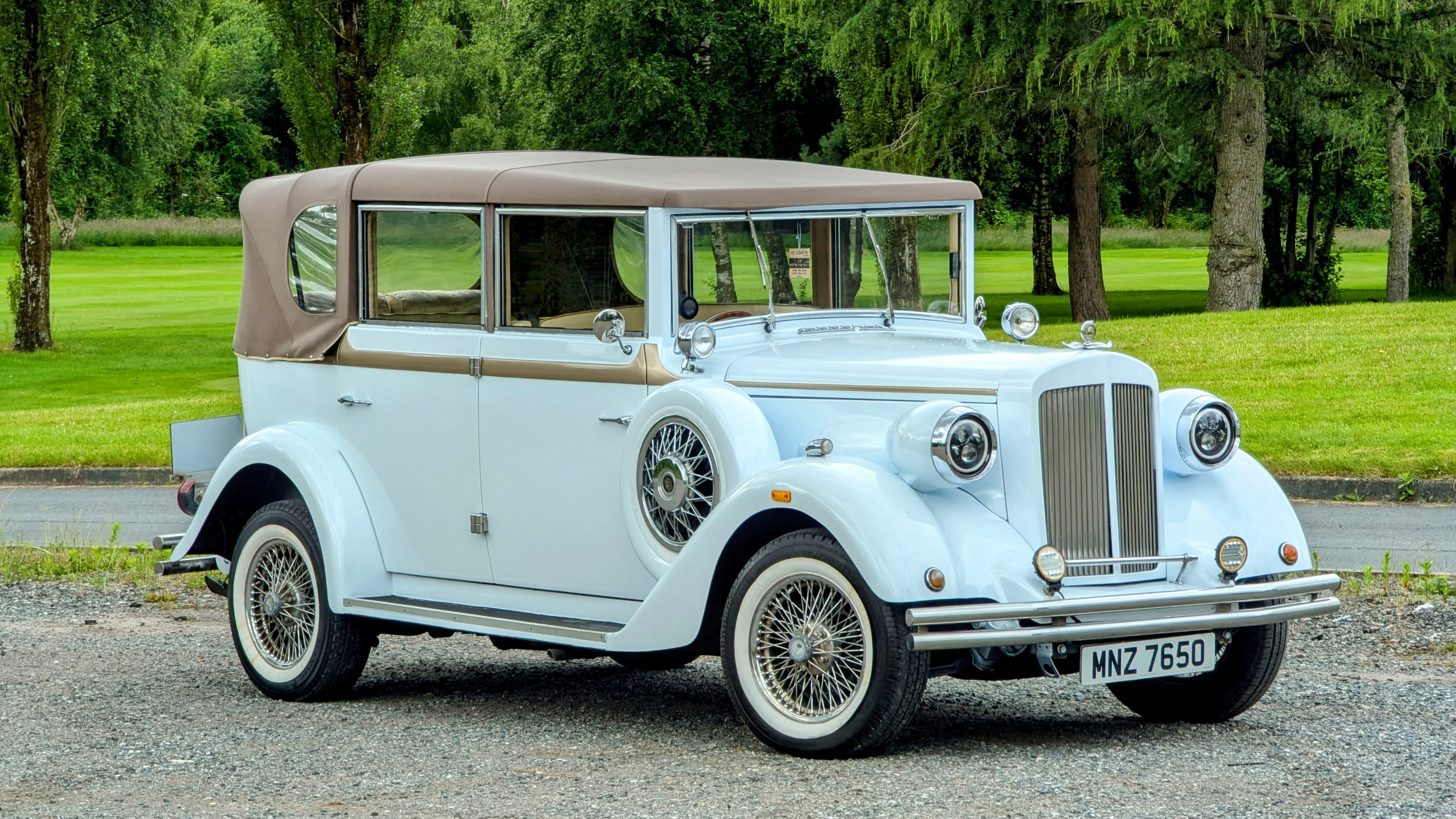 White Regent with Cream roof, white wall tires and side skirt spare mounted wheel