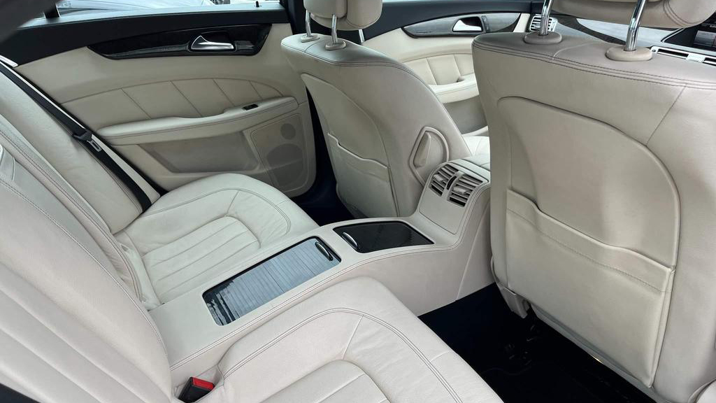 White Mercedes' cream leather rear passenger seating area in cream leather seats showing space for two passengers.