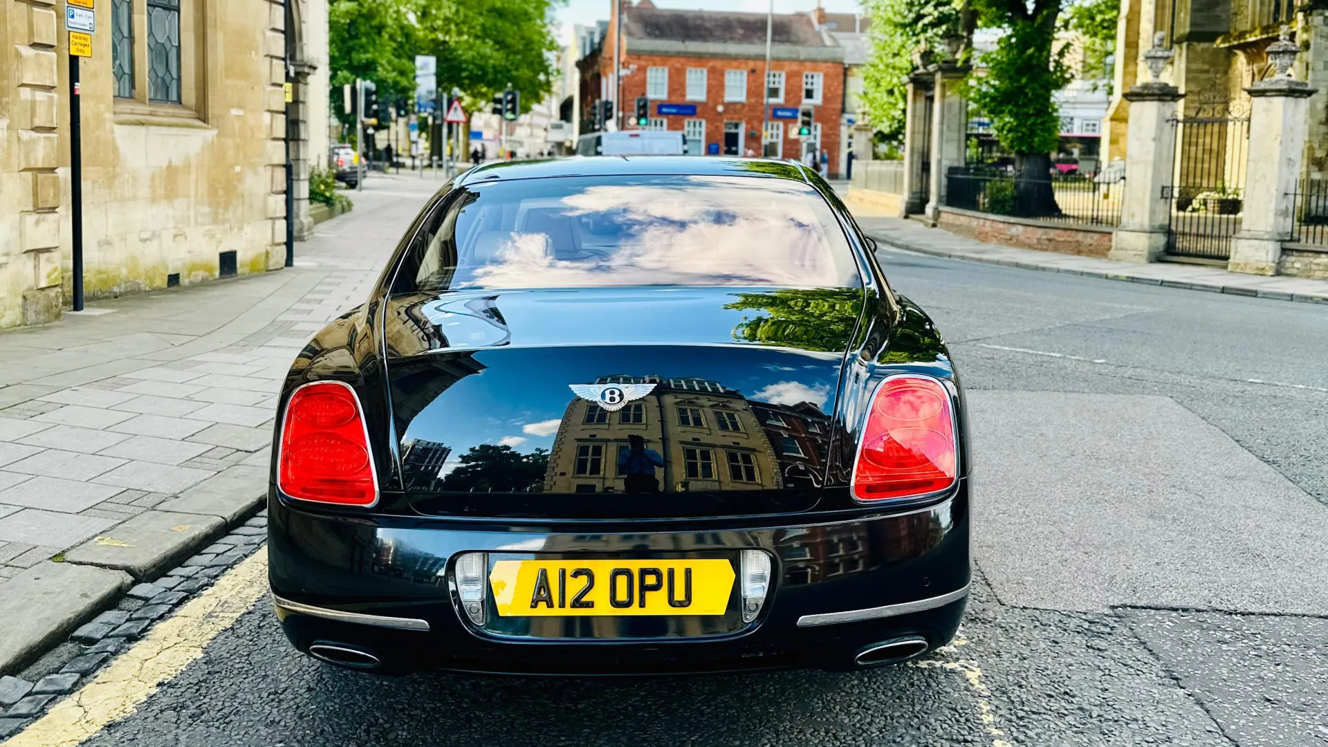 Full Rear view of Black Bentley Mulsanne with Bentley Badge in the Middle of the boot