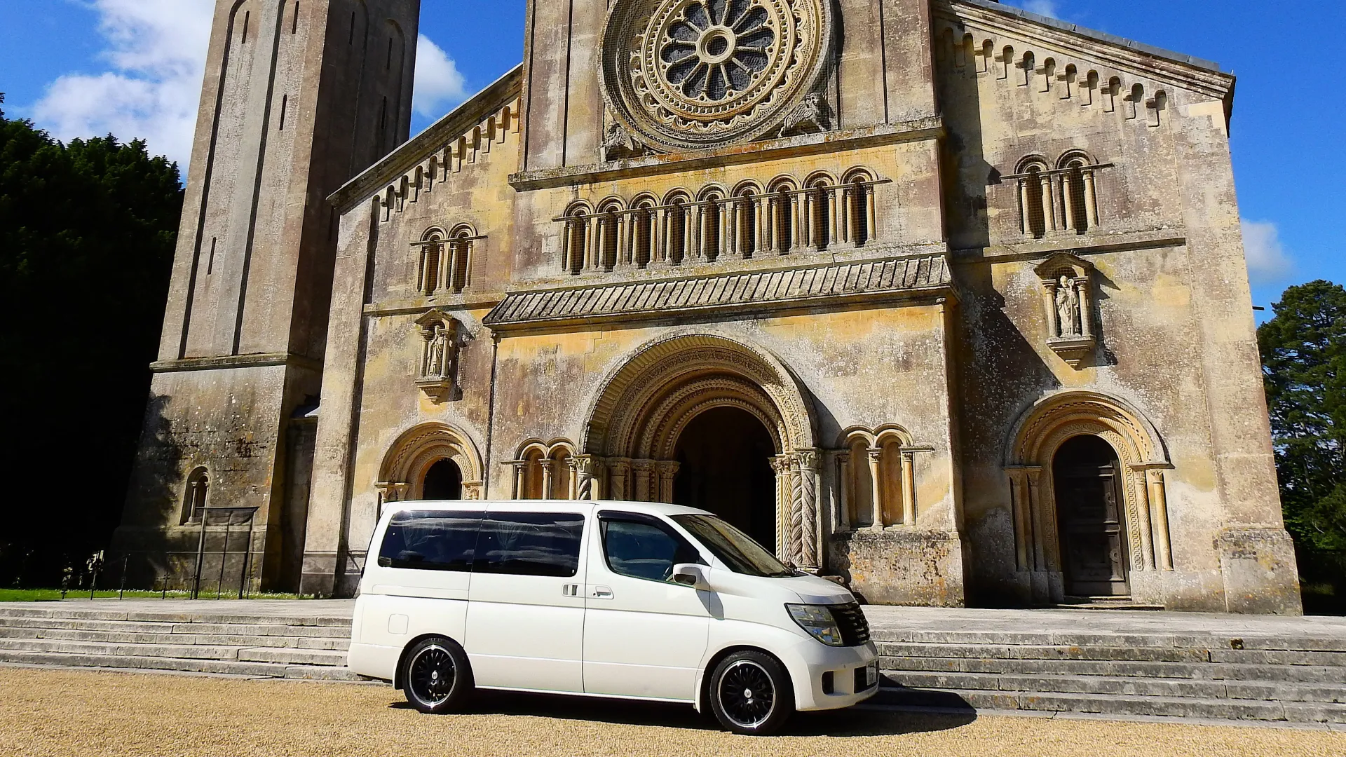 White Nissan Elgrand parked in front of the Minster in Warminster