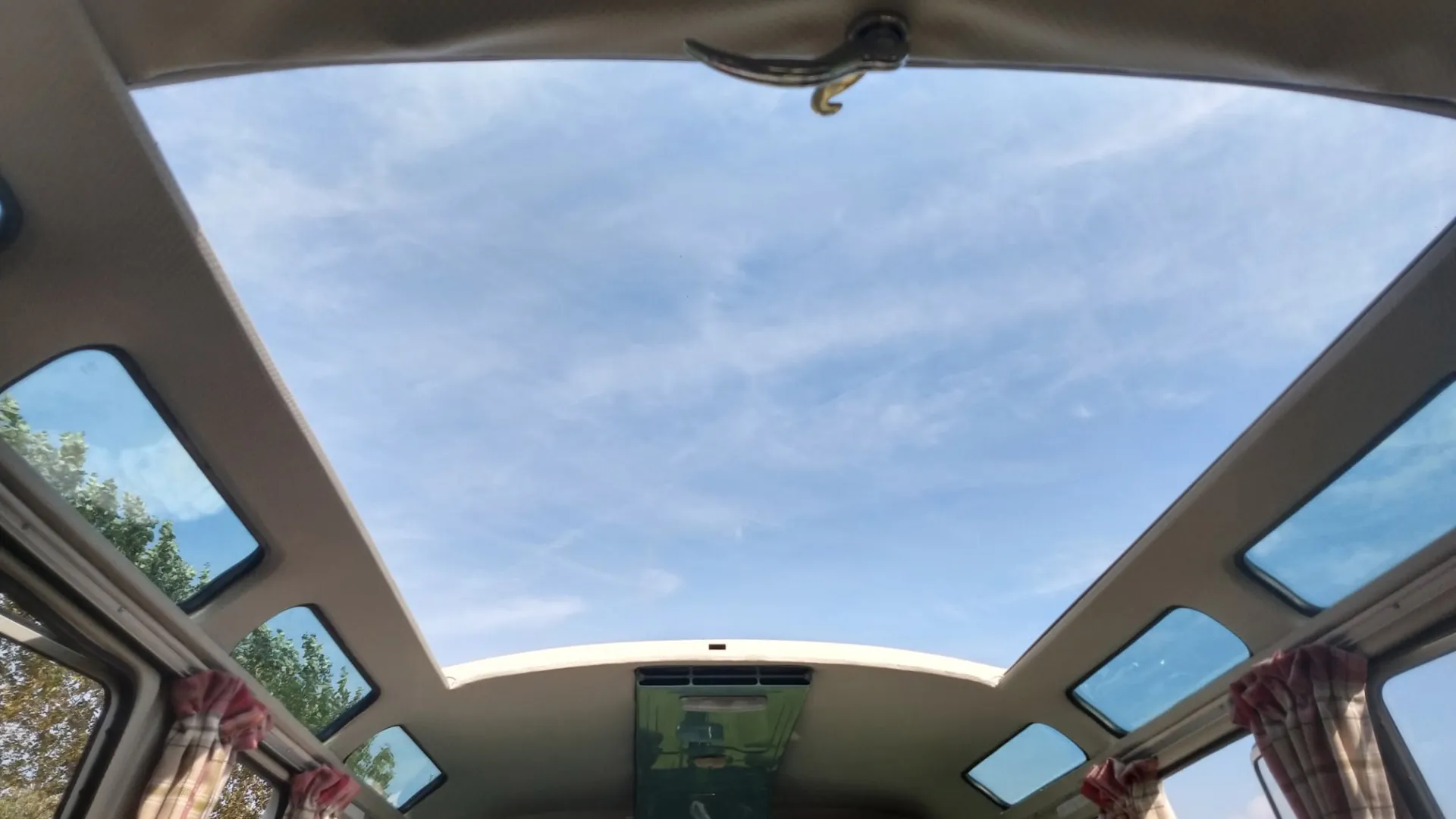 Fully opened roof in classic campervan.