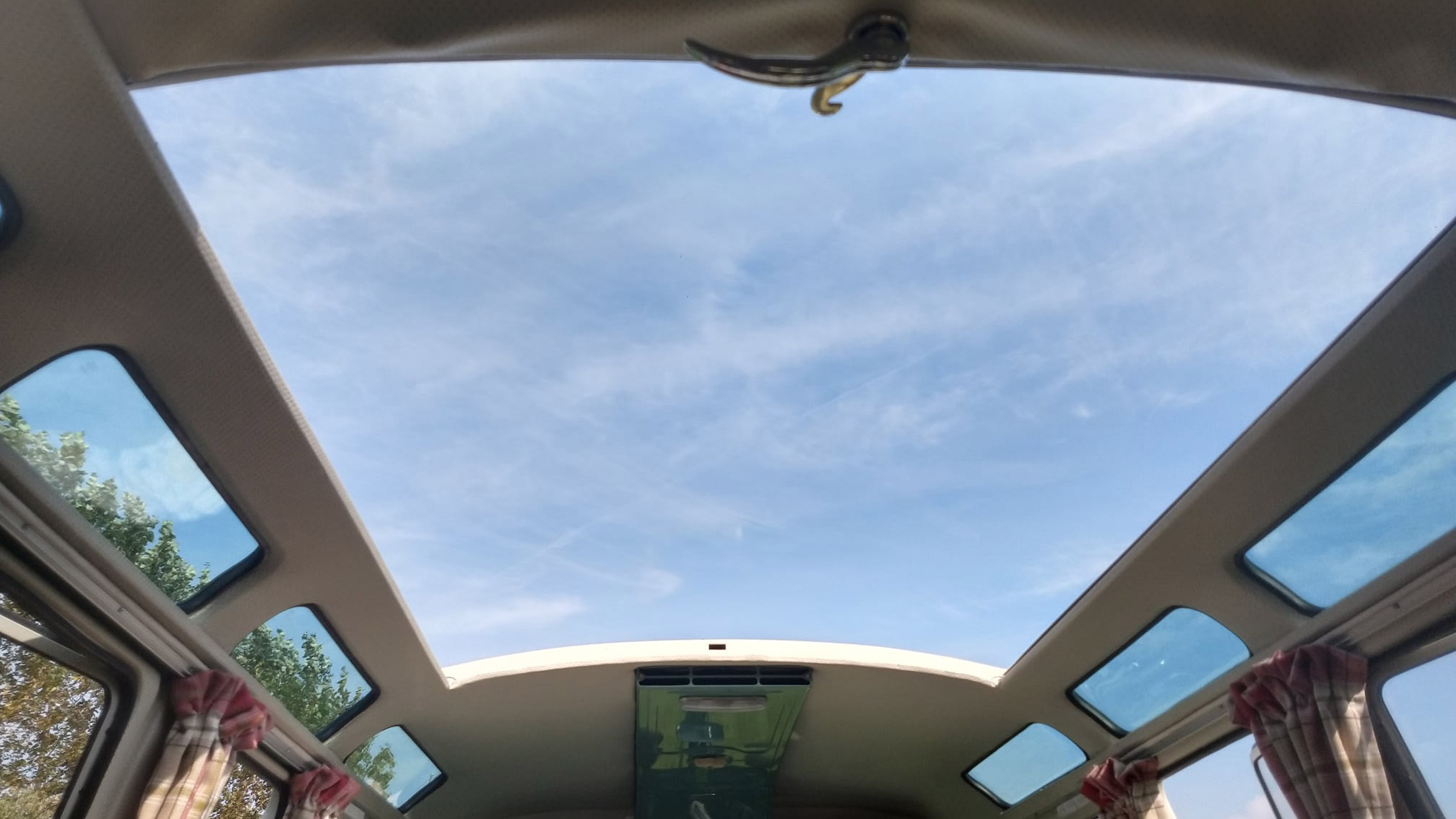 Fully opened roof in classic campervan.