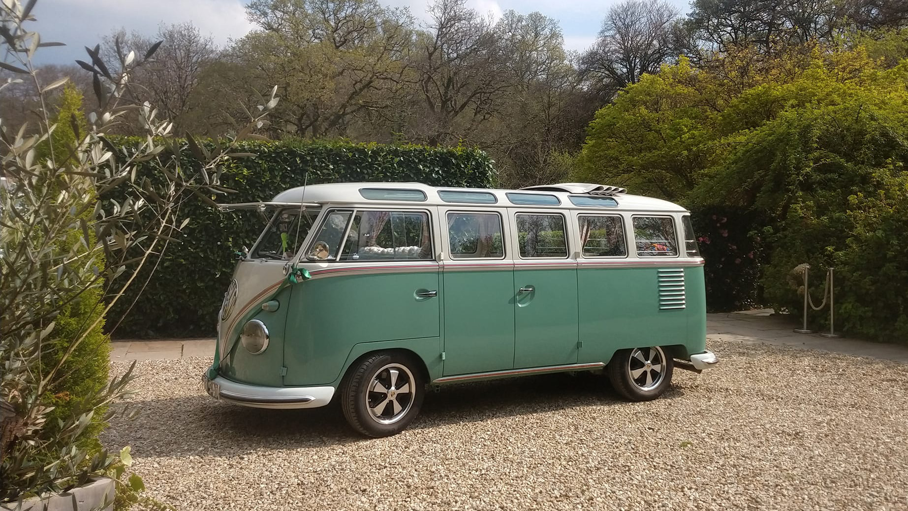 Left side view of campervan in two tone White and Pale Green on wedding duties