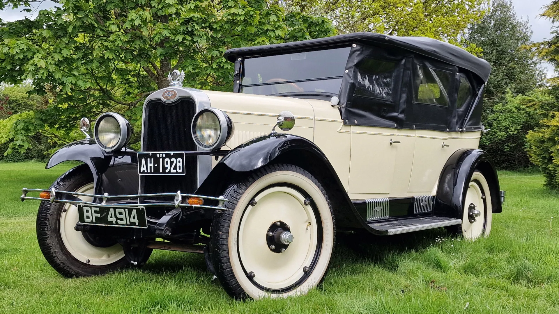 American Vintage Chevrolet in Ivory with balck wheel arches and plain ivory wheels.