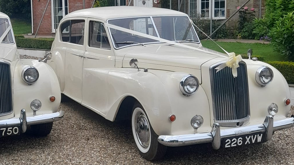 Classic Austin Princess Limousine decorated with ivory ribbons