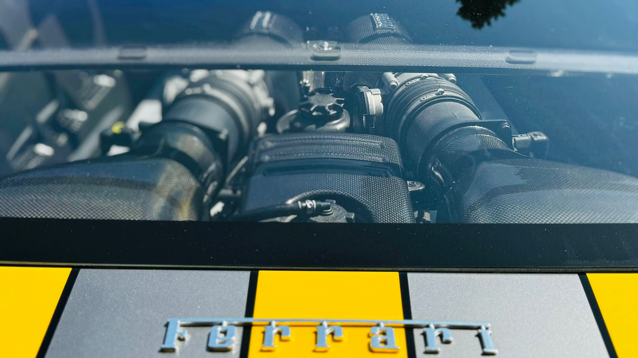 Engine view through the window at the rear or Ferrari