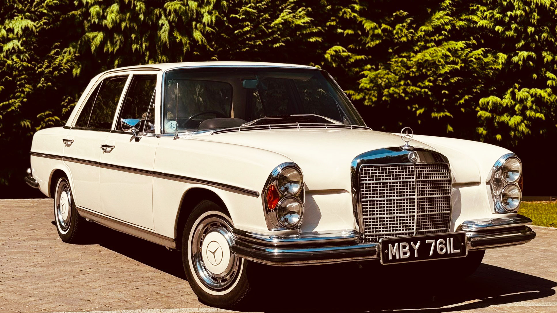 Front right side view of Classic Mercedes 280 with large chrome grill