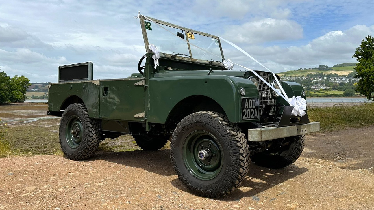 Right side view of Green Landrover without Canvas roof