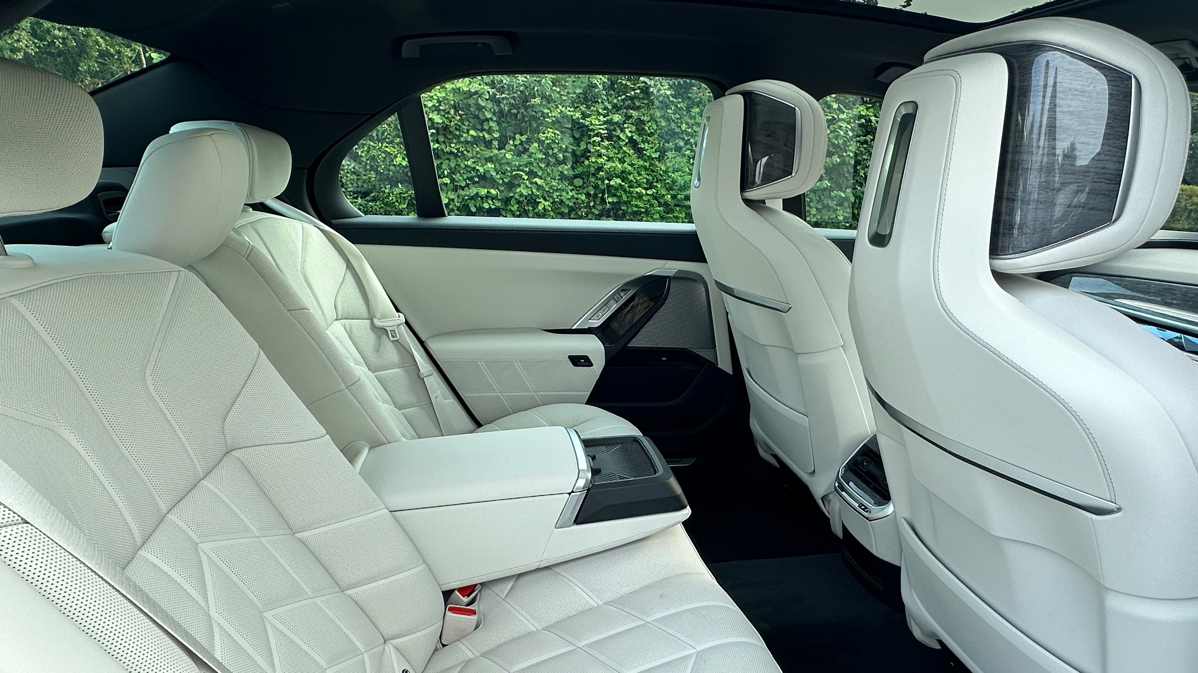 Interior rear seating in BMW i7. Cream Leather and large legroom