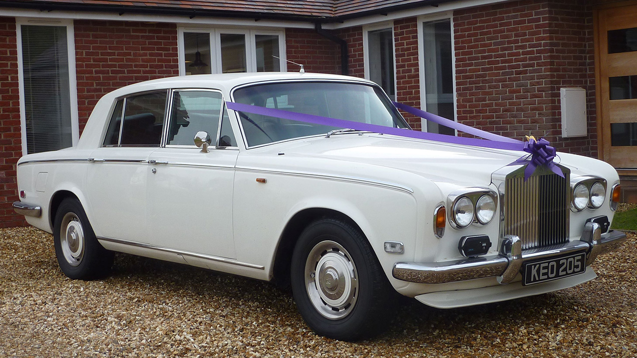 Front Right side view of Classic Rolls-Royce with wedding ribbons