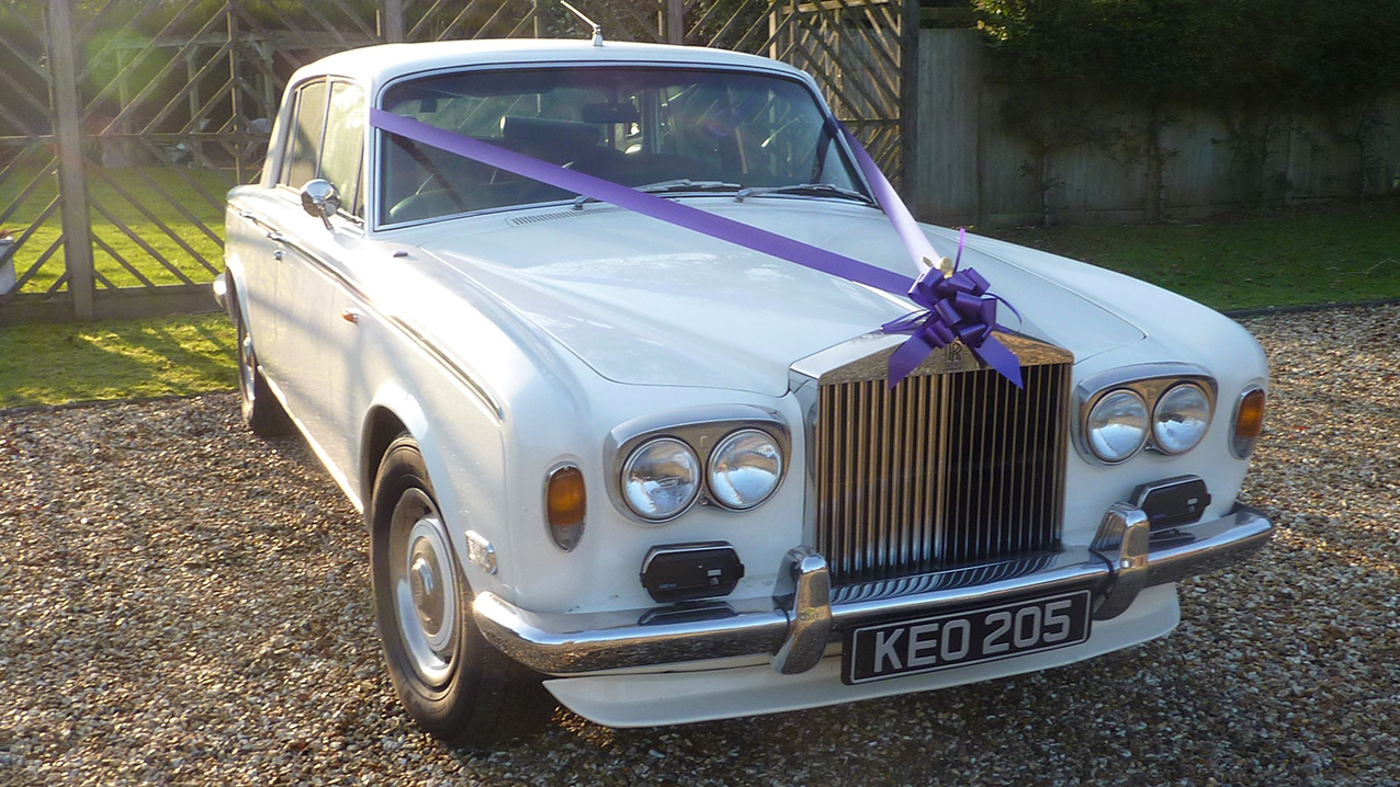 White Classic Rolls-Royce Silver Shadow mk1 dressed with Purple ribbons