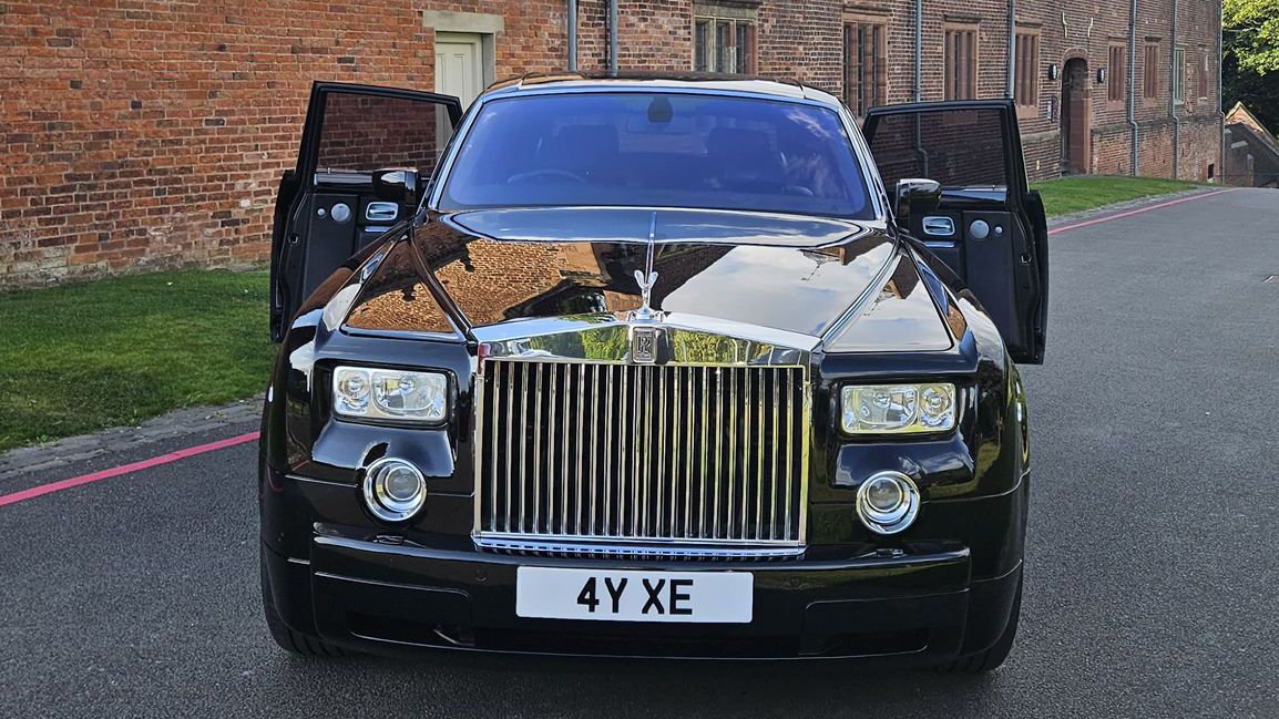 Full front view of Rolls-Royce Phantom showing large chrome front grill