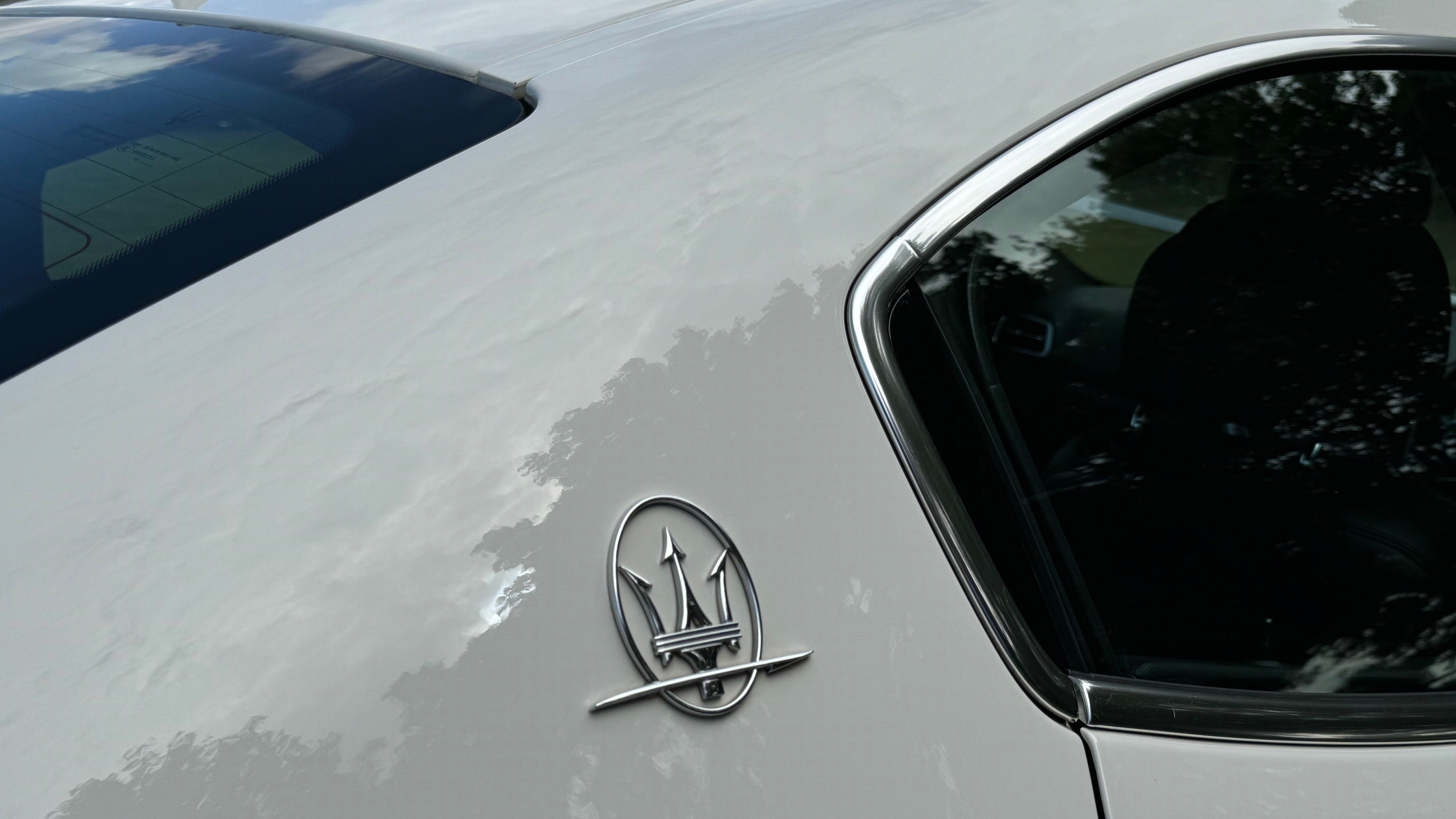 Maserati Logo on white car