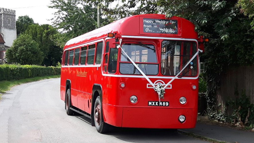 Front view of red single decker bus