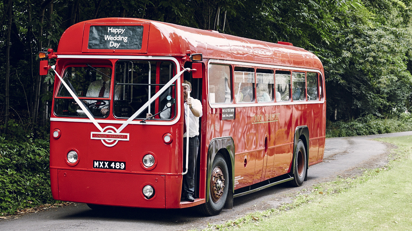 Vintage Single Decker bus decorated with white ribbons