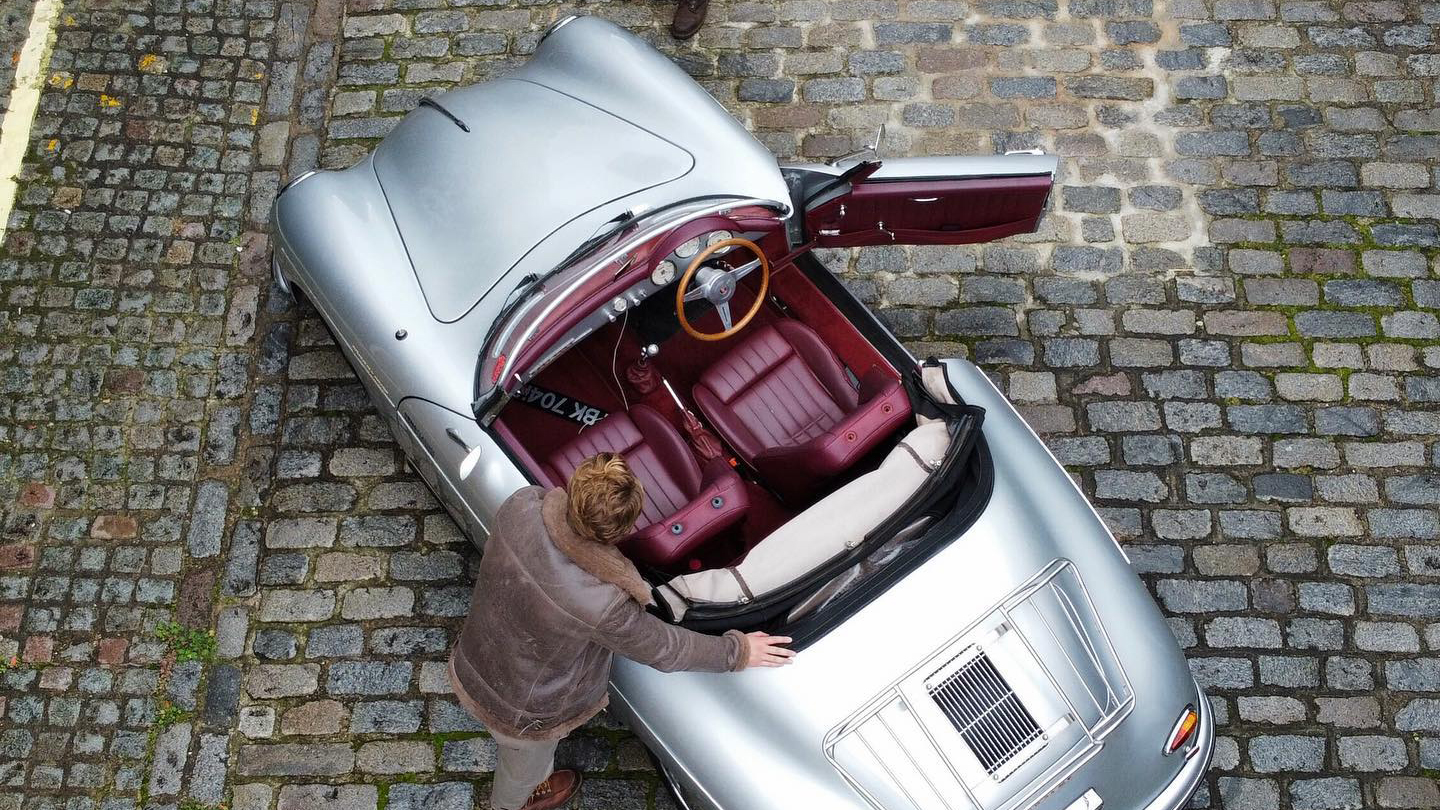 Aerial view of Classic Porsche convertible showing burgundy leather interior