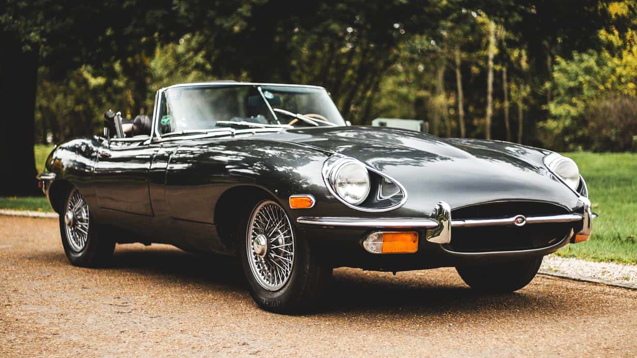 Grey Jaguar E-type Convertible with chrome spokes wheels