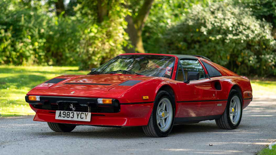 Front left side view of Red Ferrari GTSi entering wedding venue in Surrey