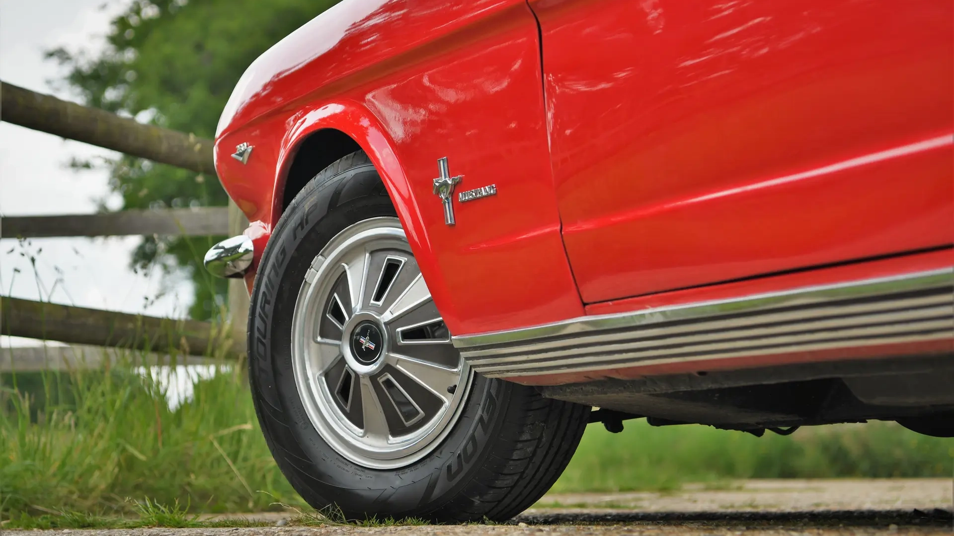 Classic wheels on Red ford Mustang