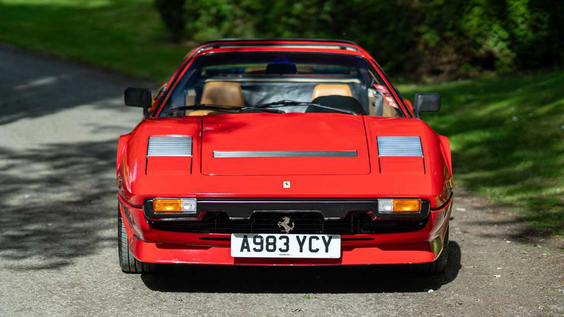 Full Frontview of Red Ferrari GTSi with pop up light on