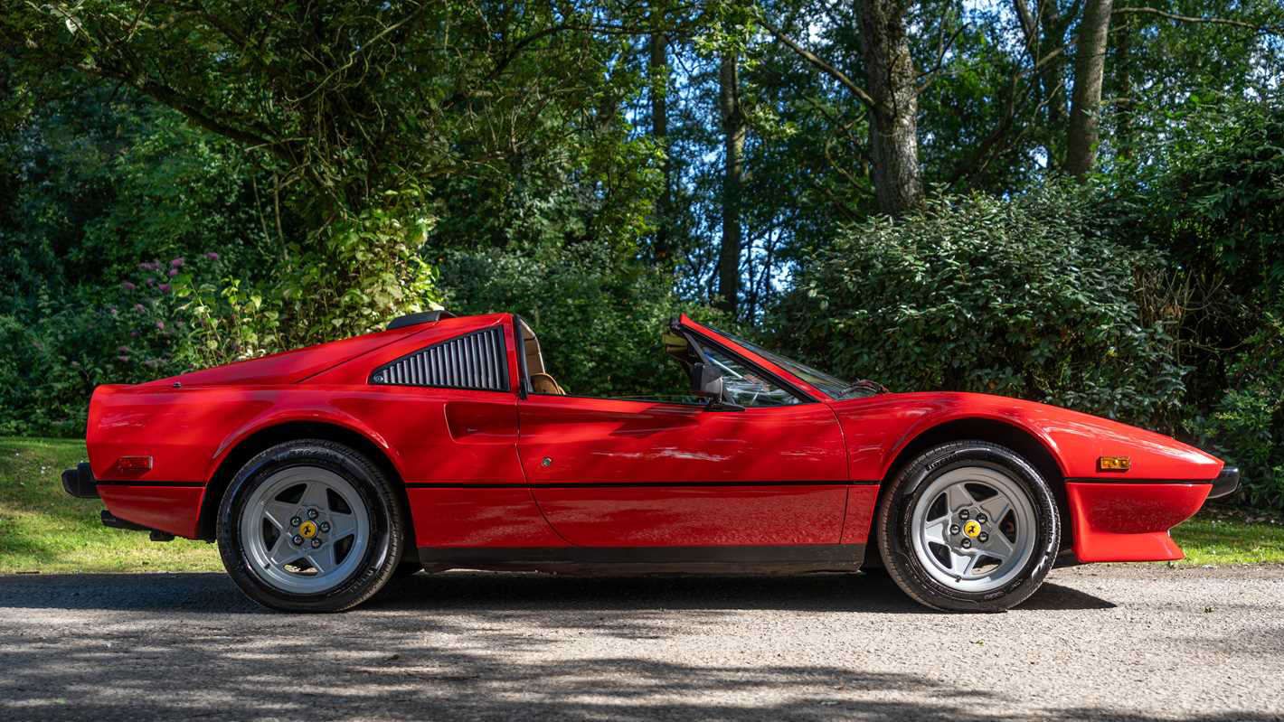 Right side view of Red Ferrari with Roof open