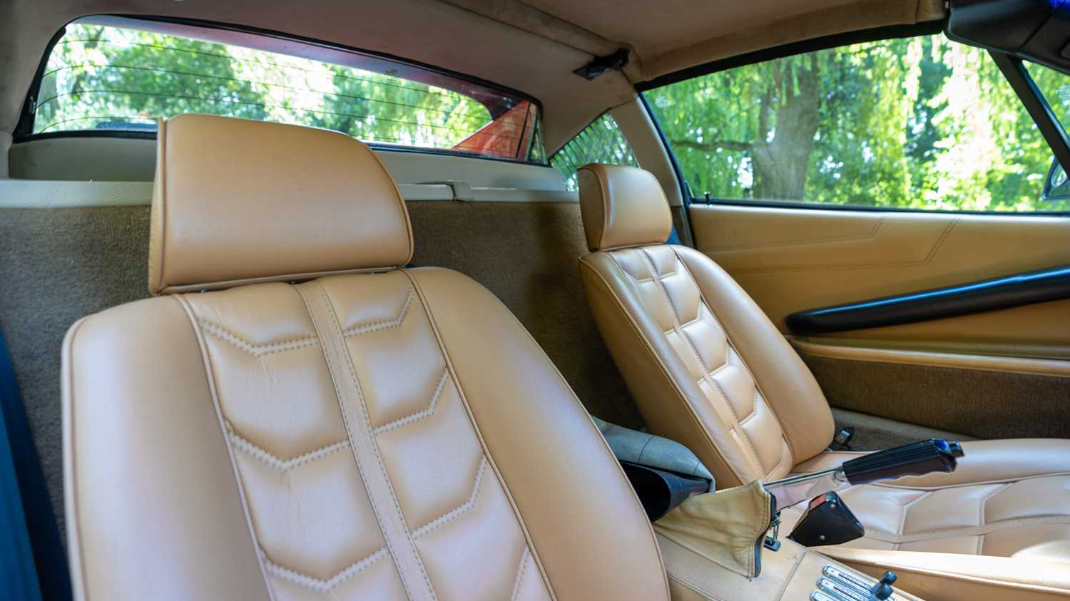 Tan Leather interior seats inside Red Ferrari