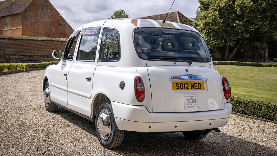 Rear view of white taxi cab at a wedding venue