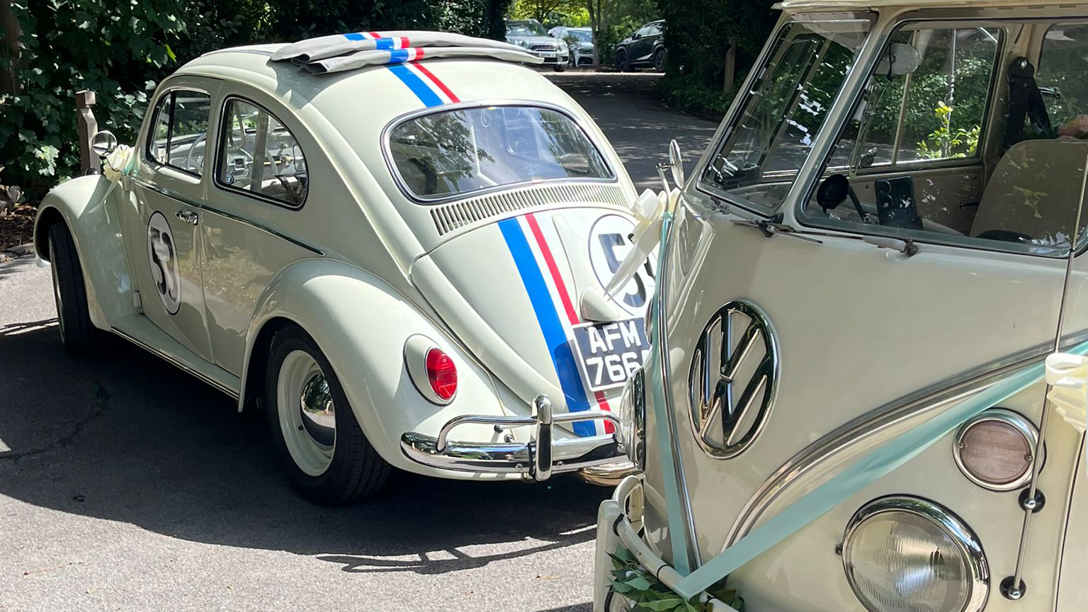 Rear view of classic Beetle "Herbie" with number 53 at the rear and blue and red lines accross.