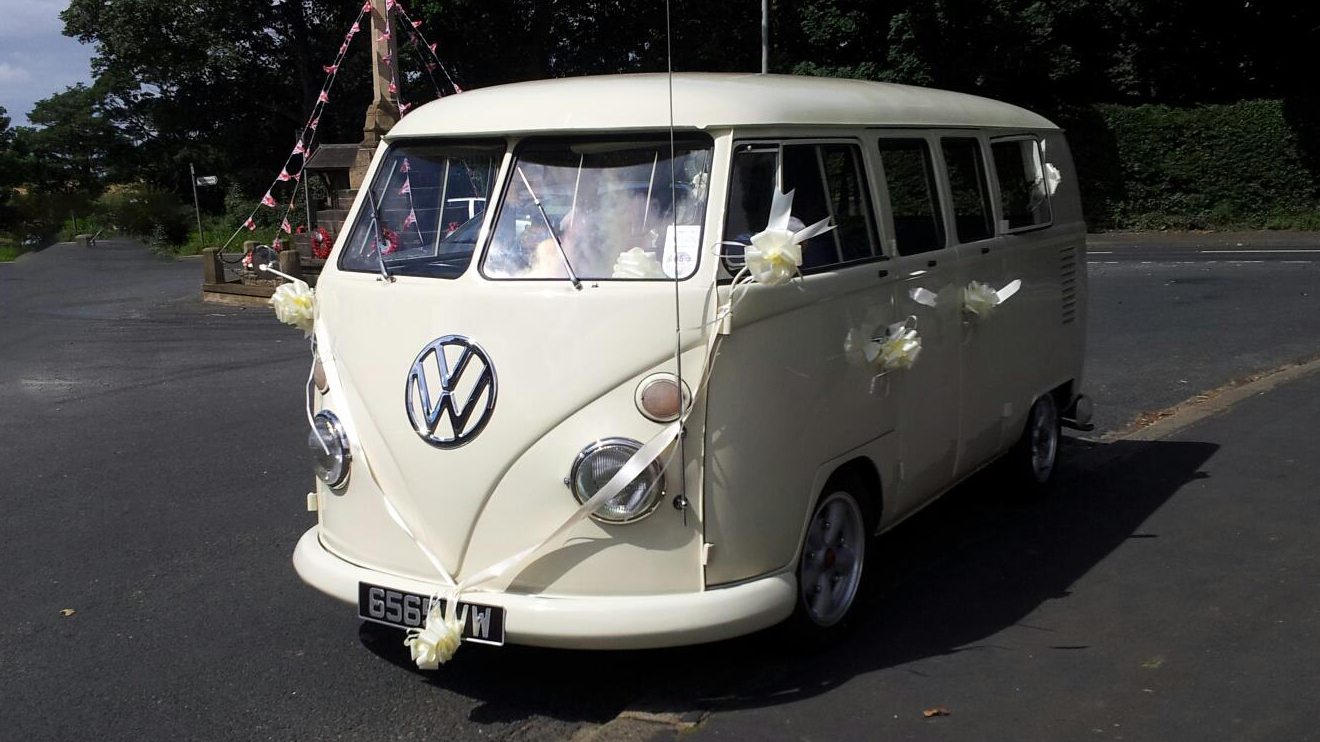 Classic VW campervan decorated with White ribbons