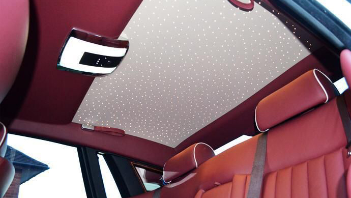 rear interior view of Sky light roof inside Rolls-Royce Phantom with Burgundy leather interior